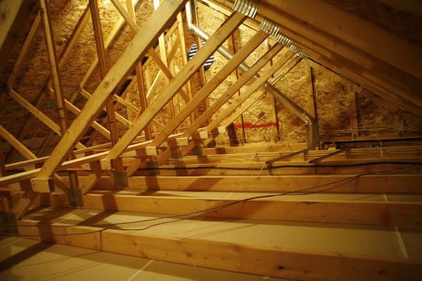 Old and damaged attic insulation being removed